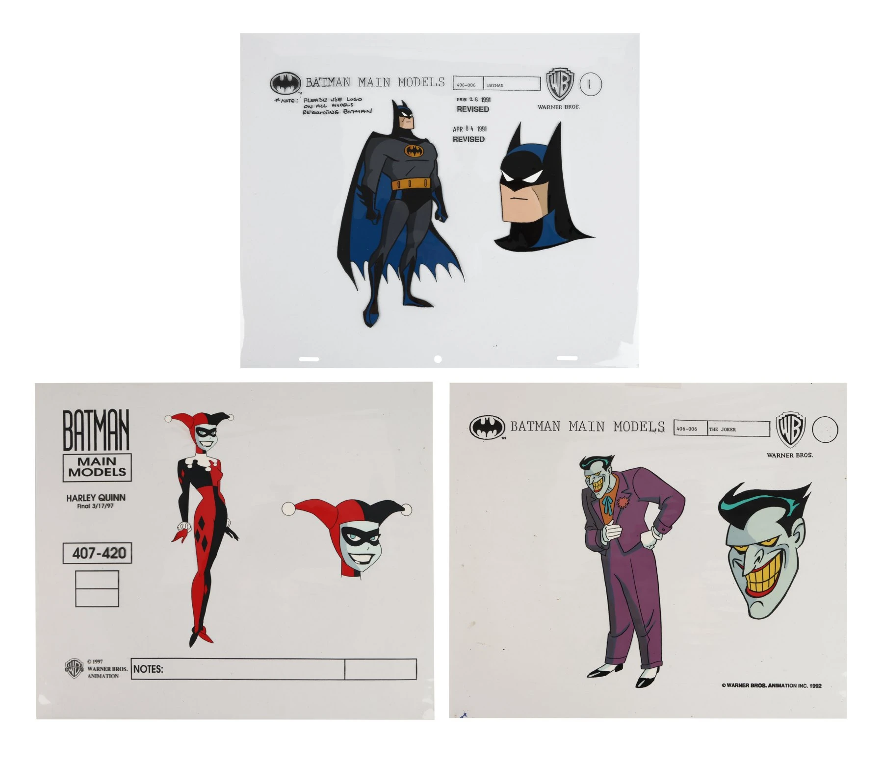 Three painted color-model cels photographed on white: Batman with header and revision stamps at top, Harley Quinn on a later 'BATMAN MAIN MODELS' form at lower left, and the Joker at lower right