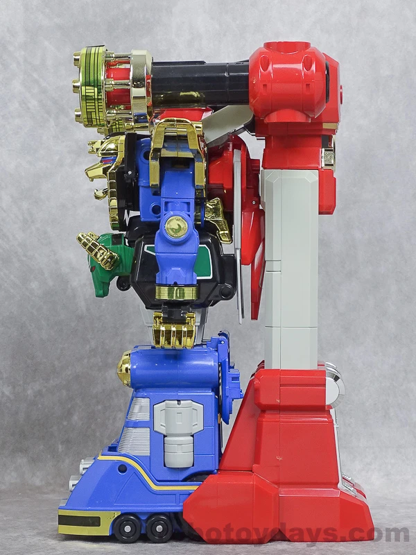 Side view of Buster Ohranger Robo showing Red Puncher's long silver legs and red feet behind Ohranger Robo, with a gold arm cylinder projecting forward above the shoulder.