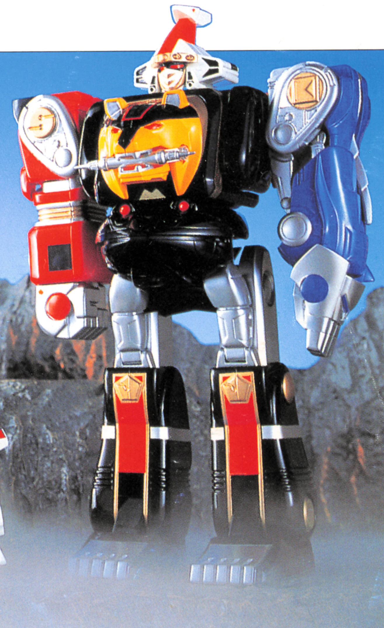 Bandai’s DX Kakure Daishogun toy standing against a blue mountain backdrop, with red and blue arms, a yellow bear-faced chest, and black legs with red panels.