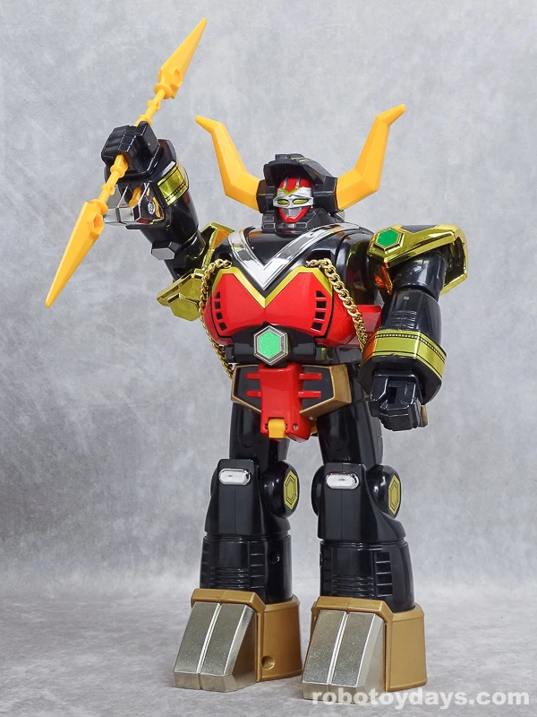 Original Japanese DX BullTaurus holding the long yellow Twin Bull Sword raised in its right fist.
