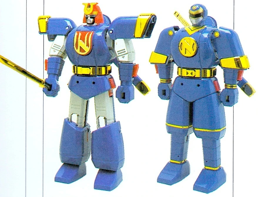 The DX Ninjaman toy photographed in two configurations: Samuraiman on the left with a red-and-gold helmet and extended shoulders, and the rounded blue Ninjaman on the right.