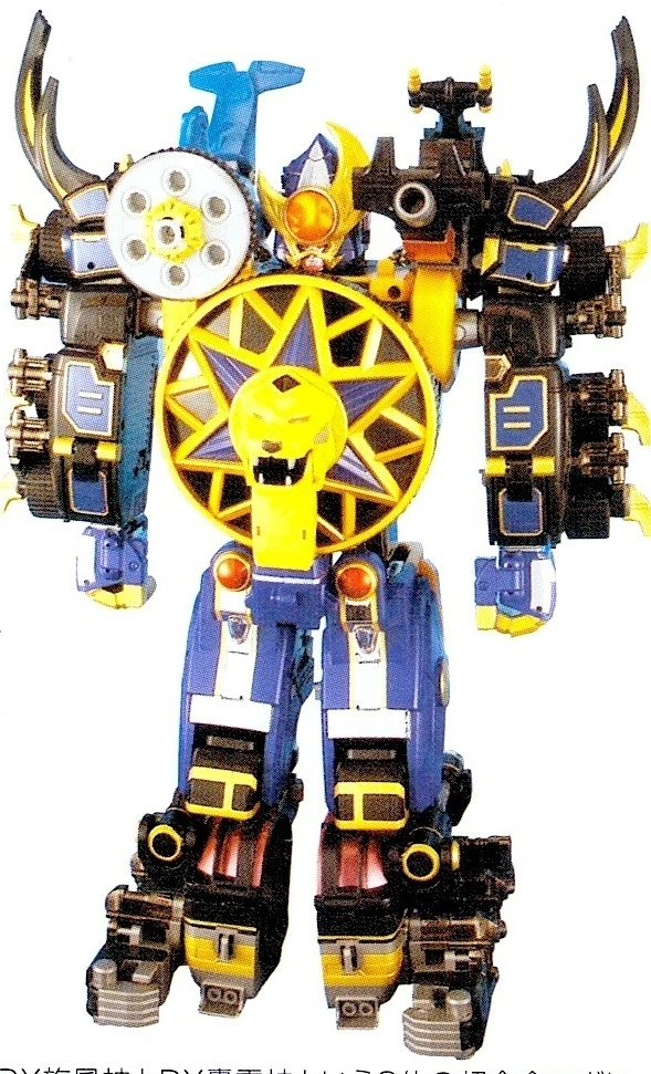 Photograph of the corresponding DX Gourai Senpuujin assembly, with yellow lion-wheel chest and black beetle components.