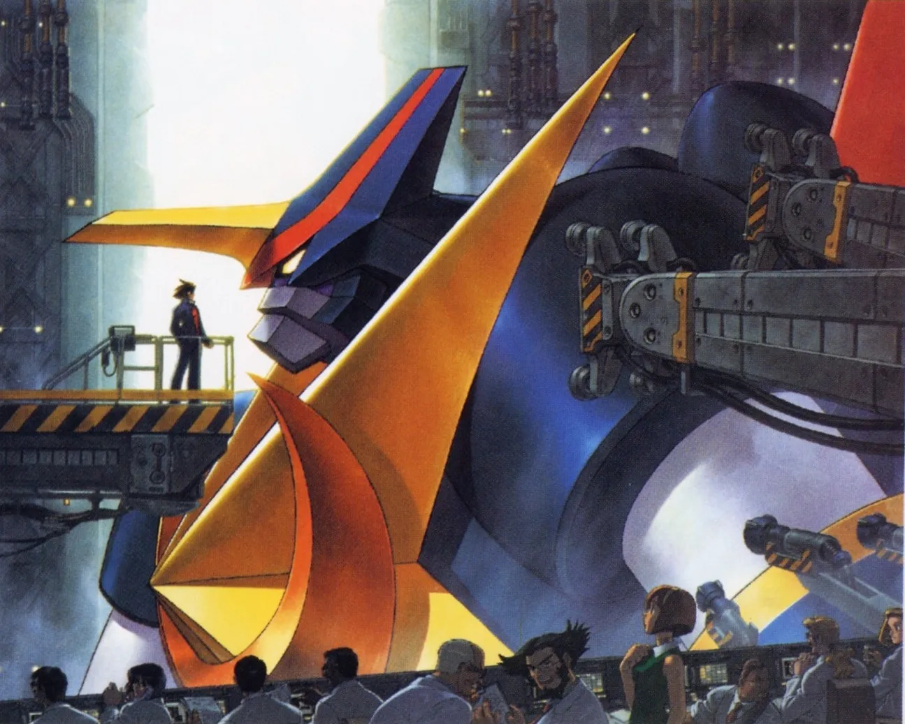 Kikaioh’s enormous blue and gold head fills a hangar while a pilot stands on a platform at face level and workers gather below.