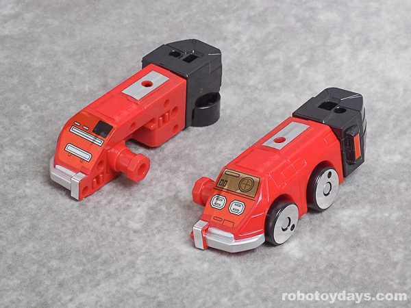 GigaWheel 4 toy divided lengthwise into two red and black arm halves.