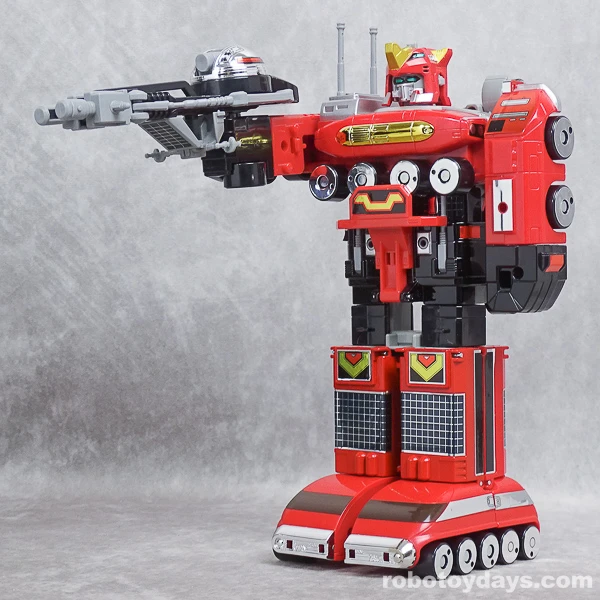 Original GigaRhinos toy holding its assembled cannon in one hand.