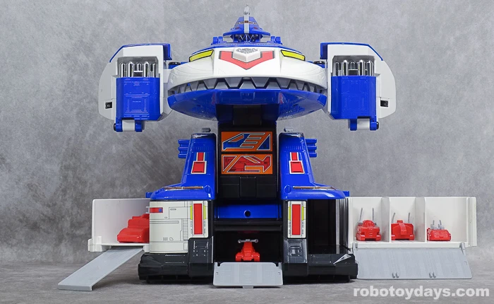 Original GigaBitus toy with five red miniature ground vehicles in open lower bays.