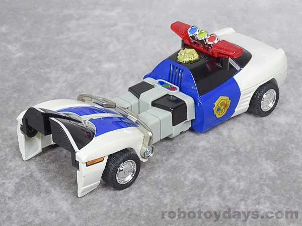Original DX Sirender midway through transformation, with two blue legs extended in front of the car cabin.