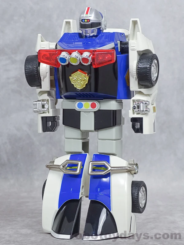 Original Japanese Bandai DX Sirender in robot form, with white arms and blue car-front legs.