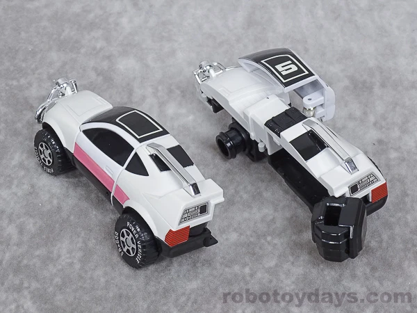 DX Pink Vehicle separated into two long car-body arms with exposed black fists.