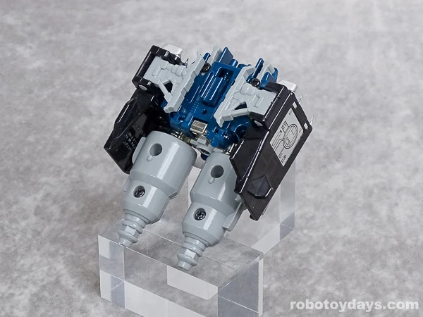 Original GigaWing 3 folded with silver thighs extending from its underside.
