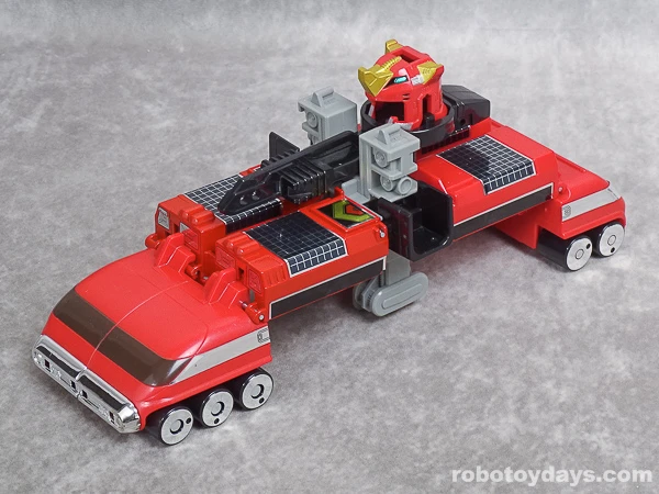 Original DX GigaWheel 5 trailer with equipment and the red helmet on its deck.