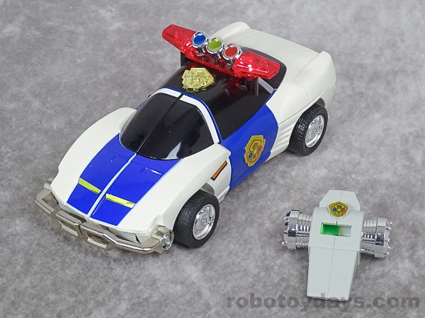 Original Japanese DX Sirender in patrol-car form beside the included white Signal Whistle.